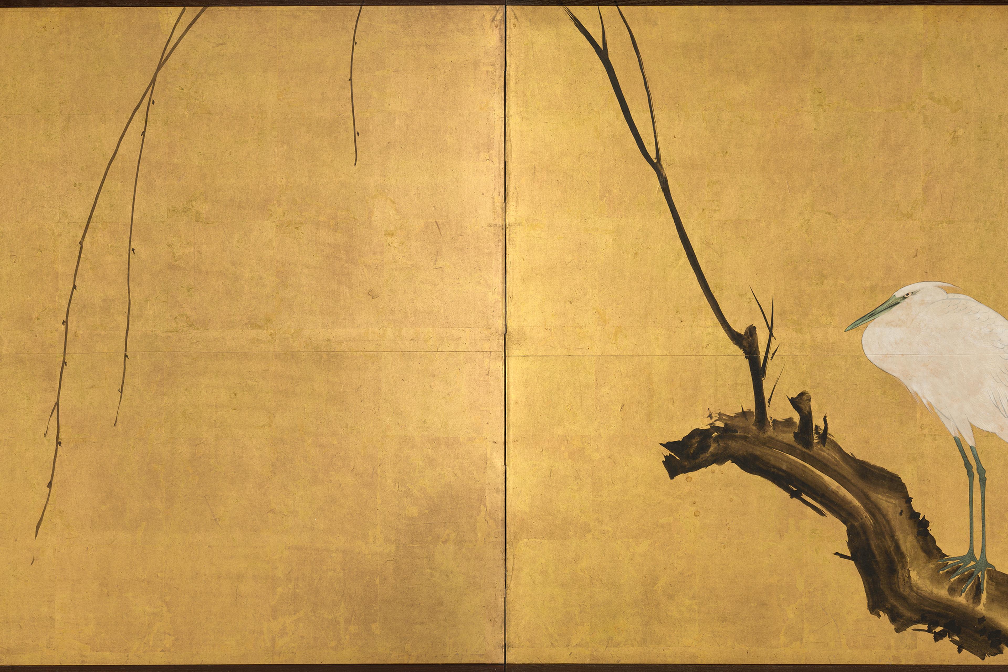 Traditional Japanese style painting of a white bird on a branch against a gold background.